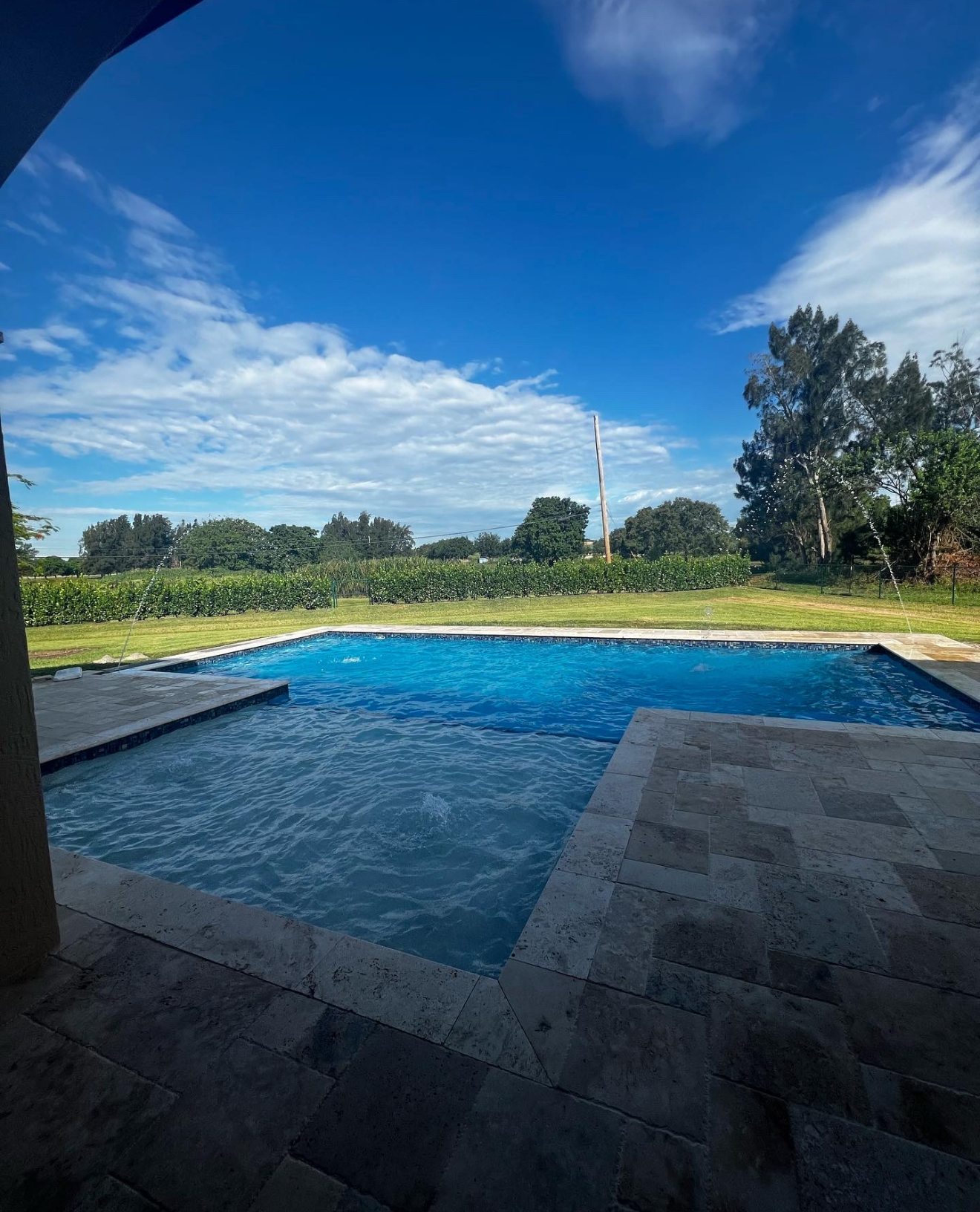 Pool with deck jets & travertine border